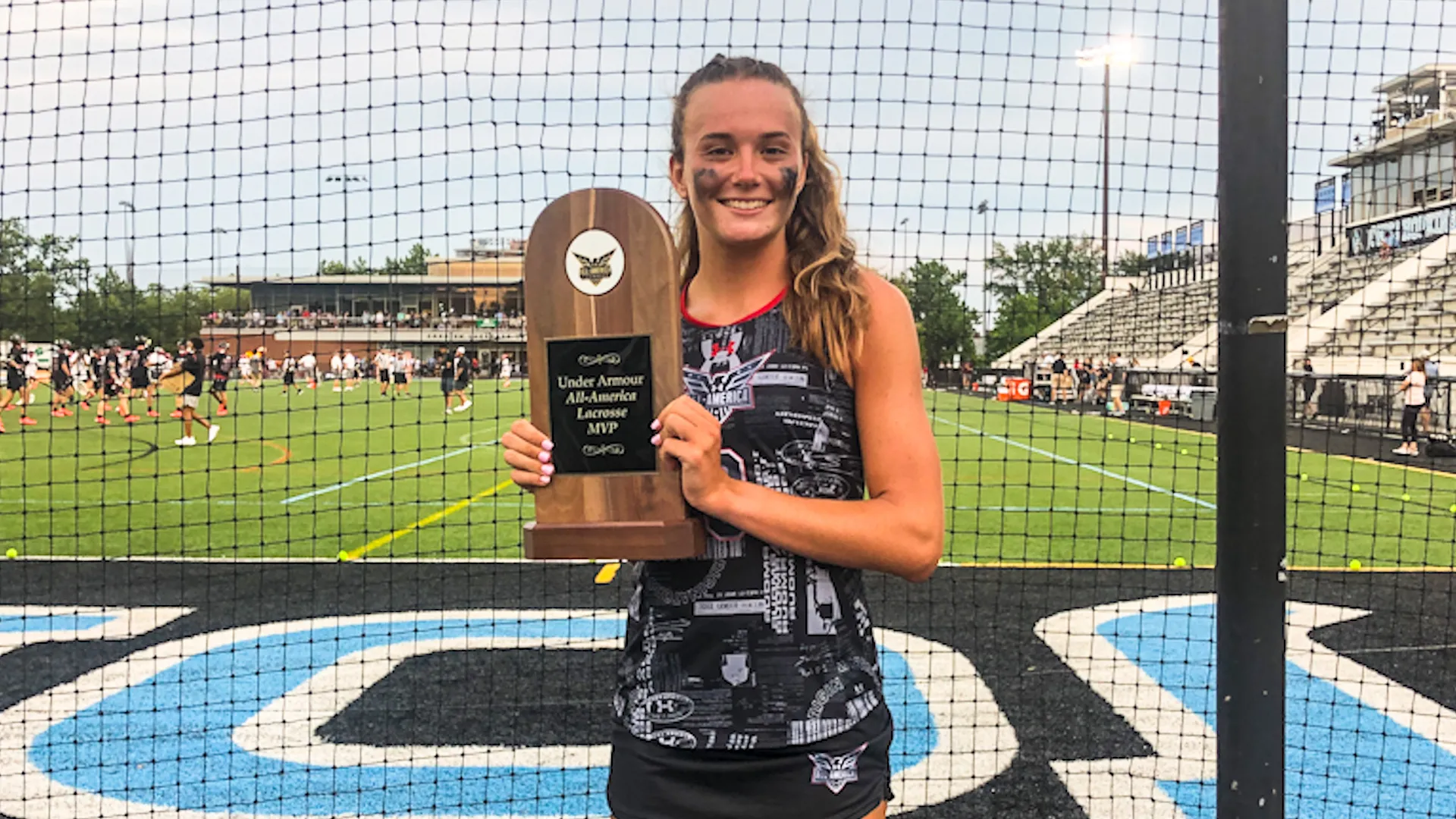 Chase Boyle with her 2021 Under Armour All-America MVP trophy at Johns Hopkins