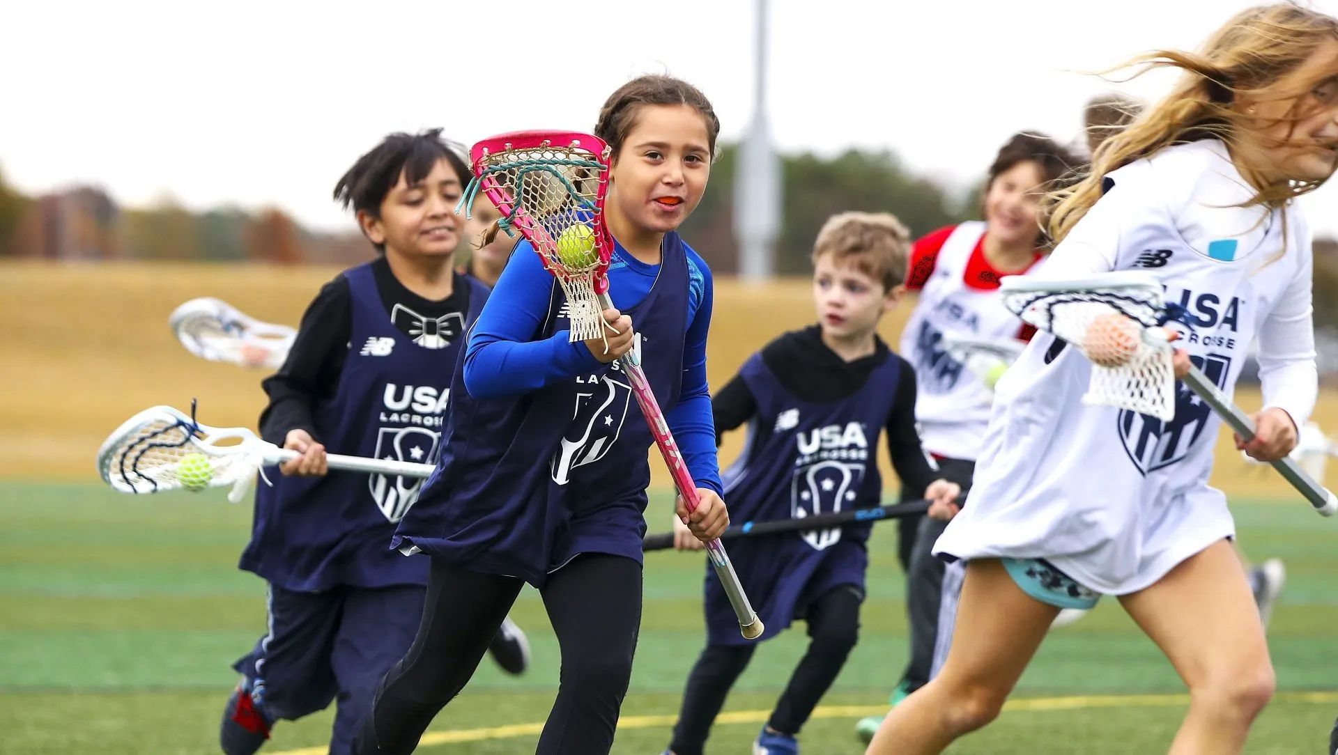 Youth players at a USA Lacrosse Pick Up and Play clinic