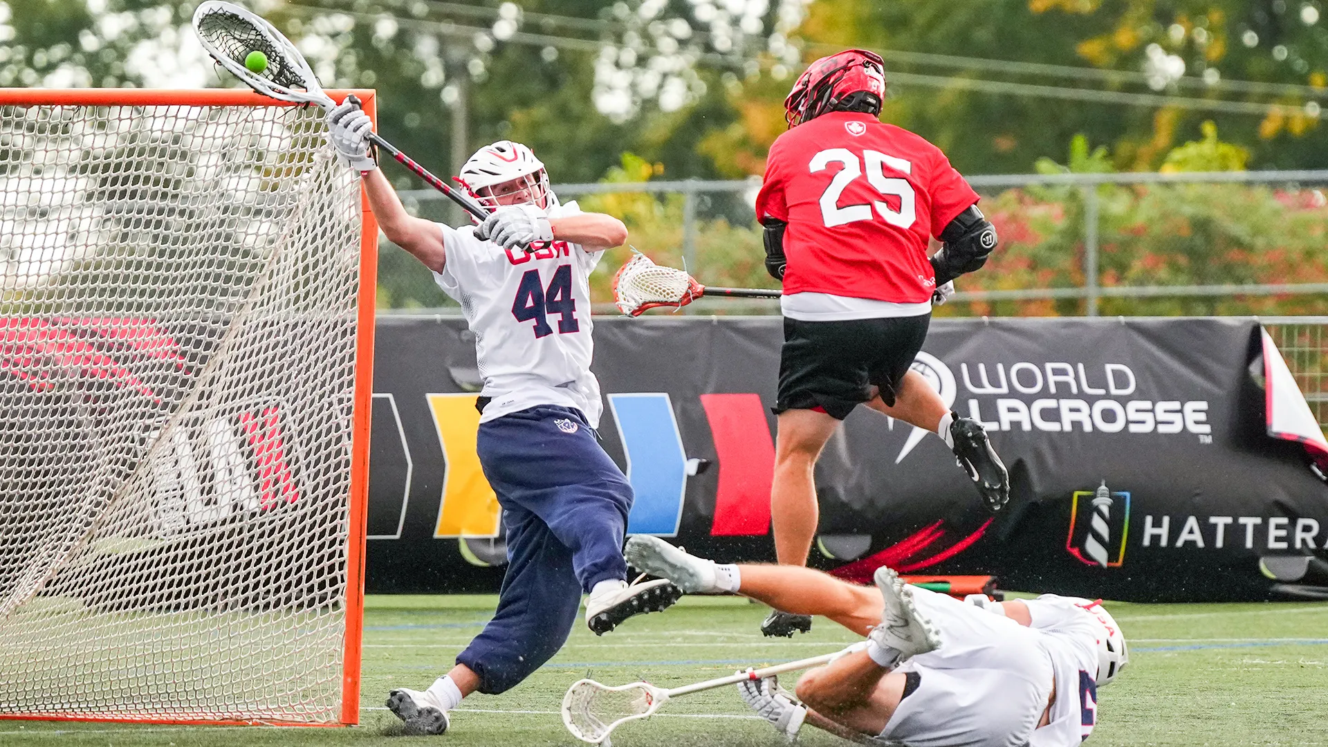 Liam Entenmann makes a last-minute save on Ian MacKay before a collision that would be penalized and lead to the game-winning goal for USA in the Pan-American Sixes Lacrosse Championship gold medal game.
