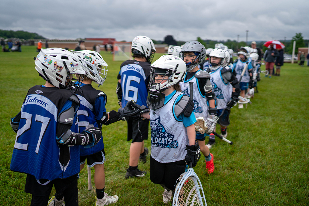 Youth players shaking hands at end of game