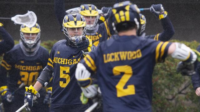 Michael Boehm (5) celebrates a goal. Boehm became the second Michigan player to eclipse 200 career points.