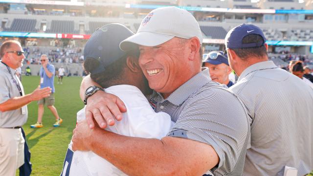 Charley Toomey hugs Trevor Baptiste after U.S. men win 2023 World Lacrosse championship