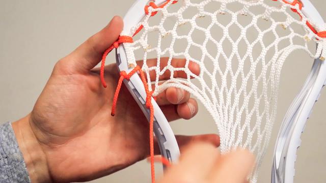 Screenshot of video tutorial for stringing lacrosse sticks.