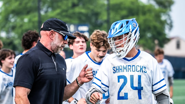 Detroit Catholic Central (Mich.) attackman Lachlan Moffatt with a coach