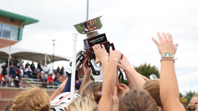 Players holding up Brogden Cup trophy