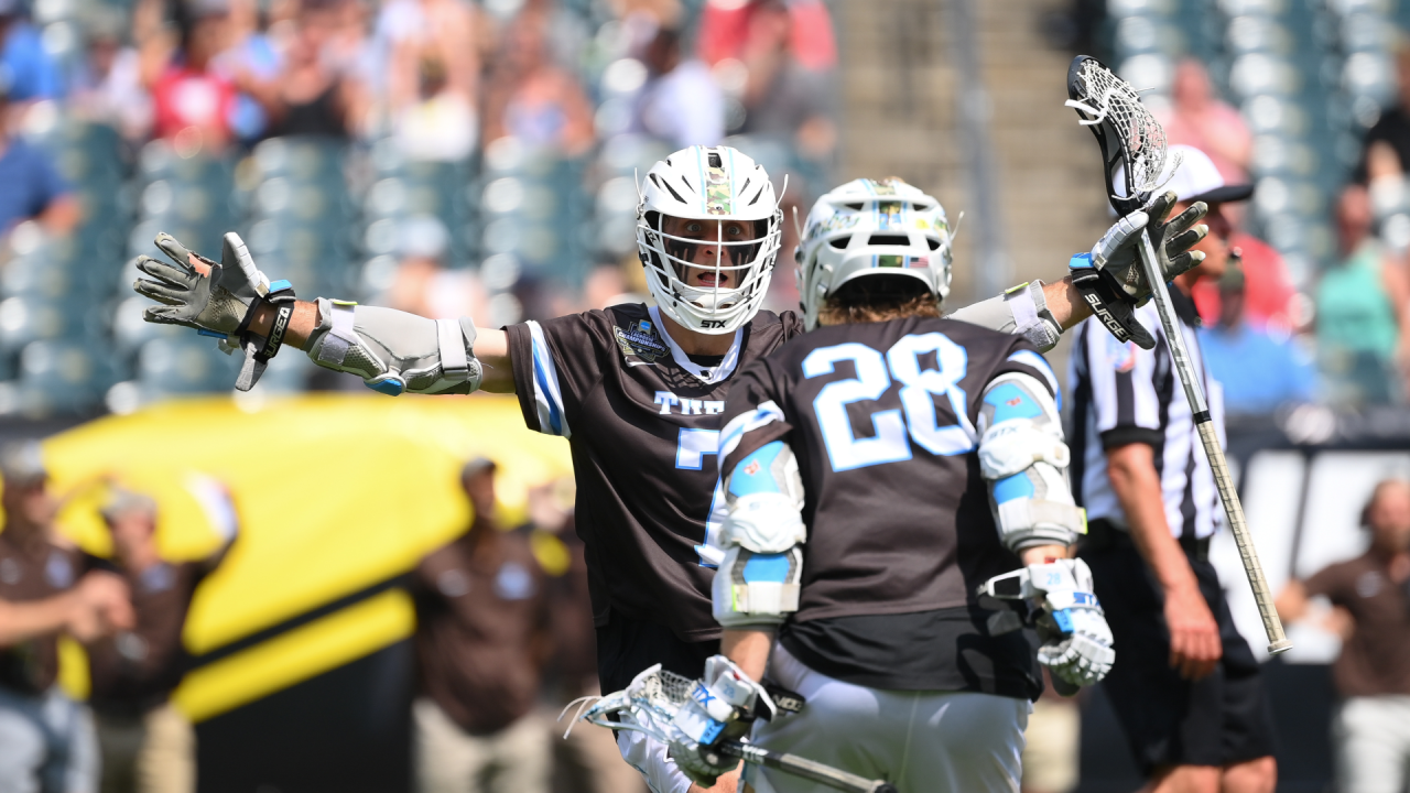 Tufts' Charlie Tagliaferri (7) and Chase Beyer (28) celebrate a goal in the NCAA Division III men's lacrosse championship game at Lincoln Financial Field in Philadelphia.