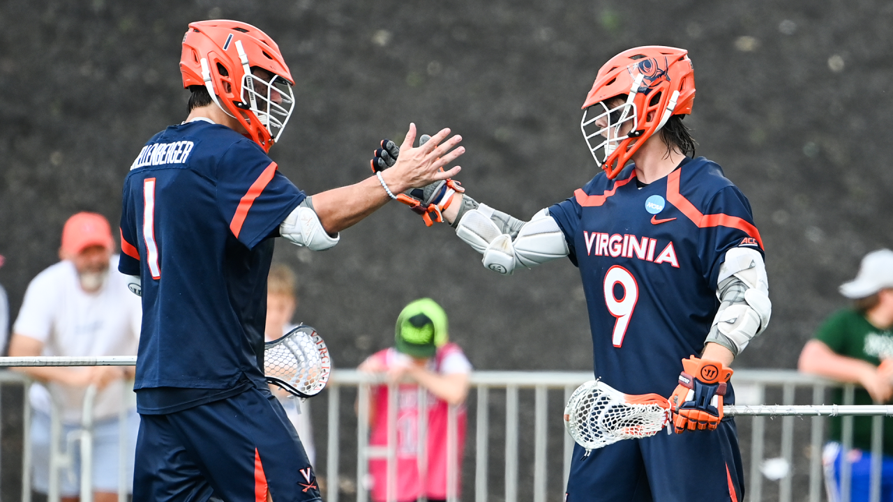 Virginia lacrosse stars Connor Shellenberger (1) and McCabe Millon (9) shake hands.