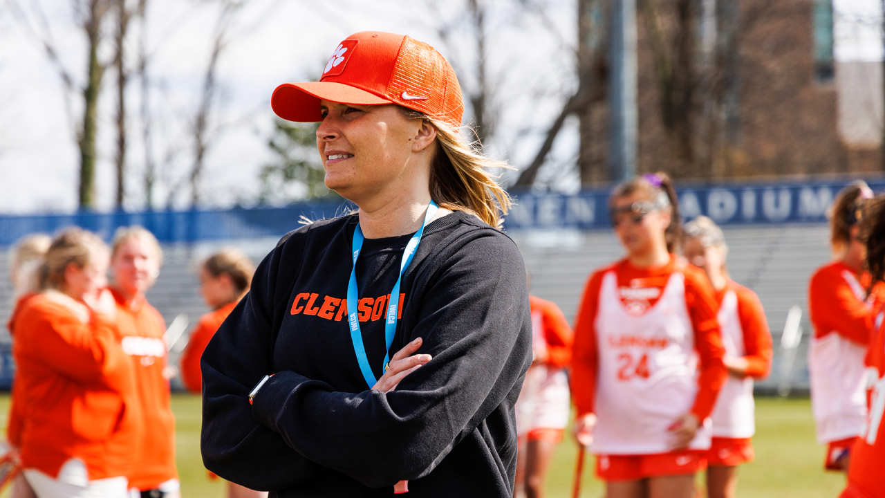 Clemson women's lacrosse coach Allison Kwolek with the team before their game at Duke