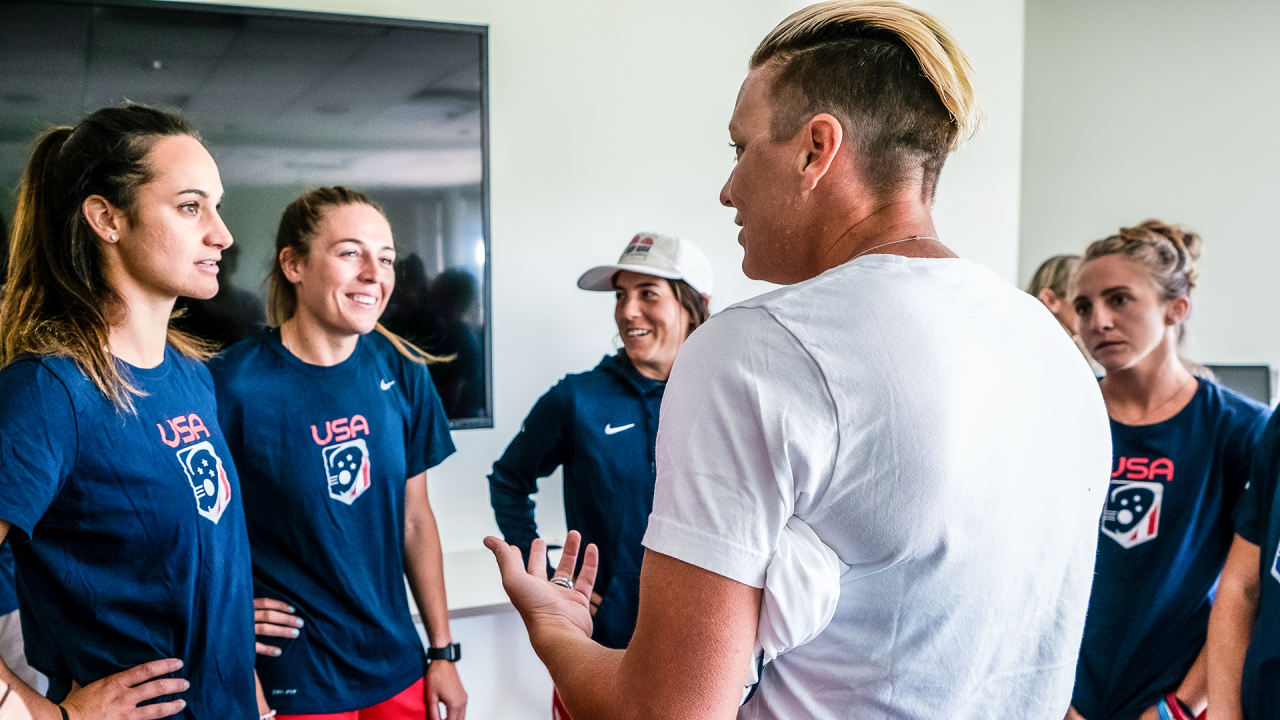 Former World Cup and Olympic soccer hero Abby Wambach speaks to members of the U.S.  Women's National Team at USA Lacrosse headquarters in June 2019