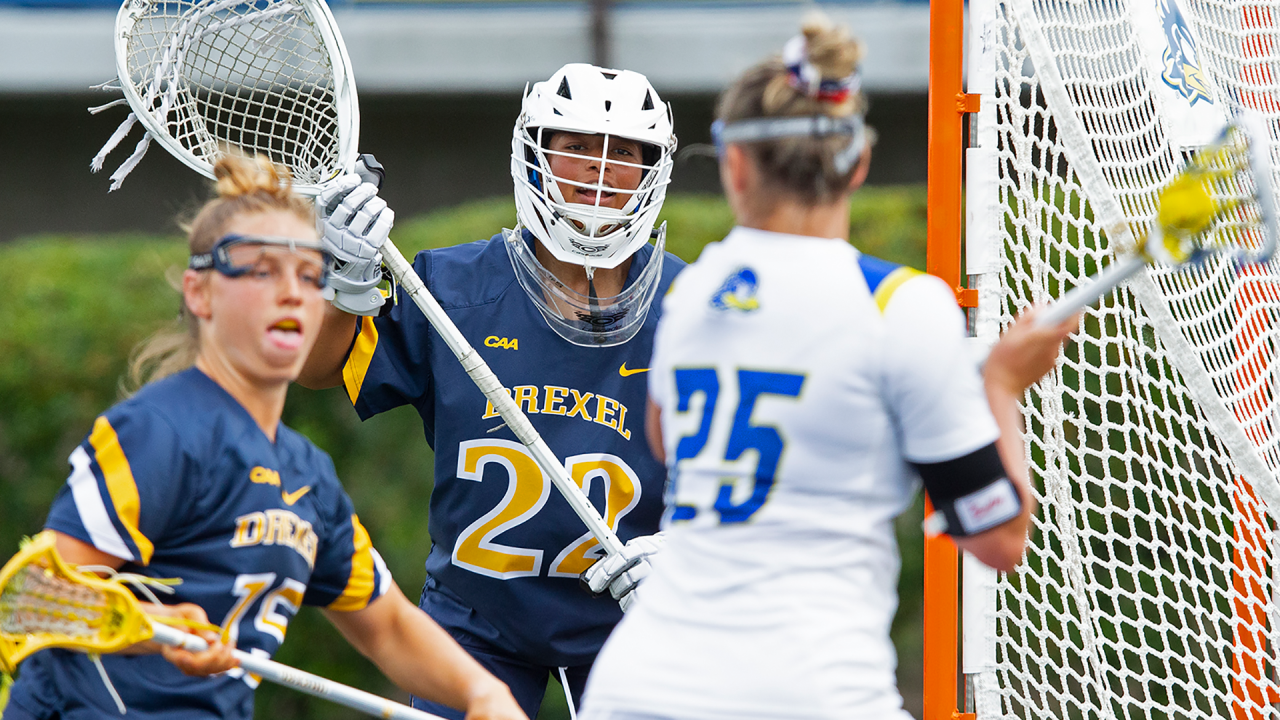 Drexel goalie Jenika Cuocco guarding the goal against a Delaware attacker during a 2024 game in Newark, Del.