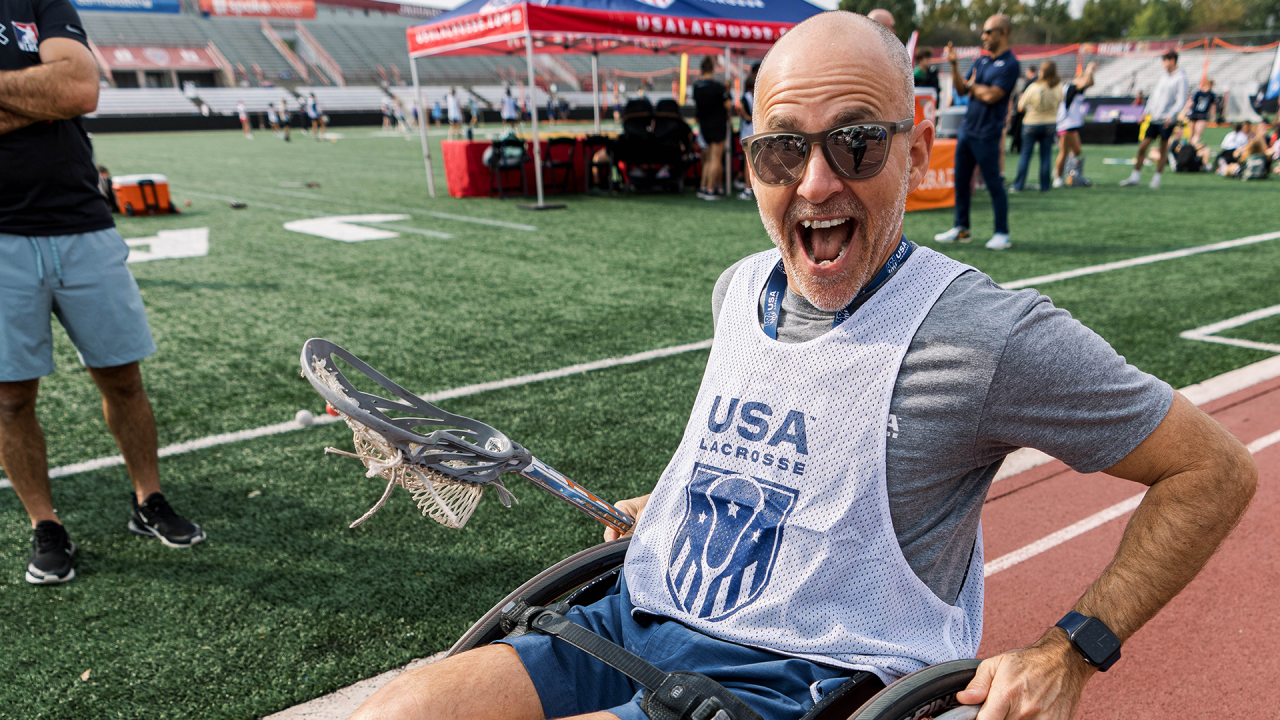 USA Lacrosse CEO Marc Riccio plays wheelchair lacrosse during an adaptive clinic at the USA Lacrosse Experience in Indianapolis.