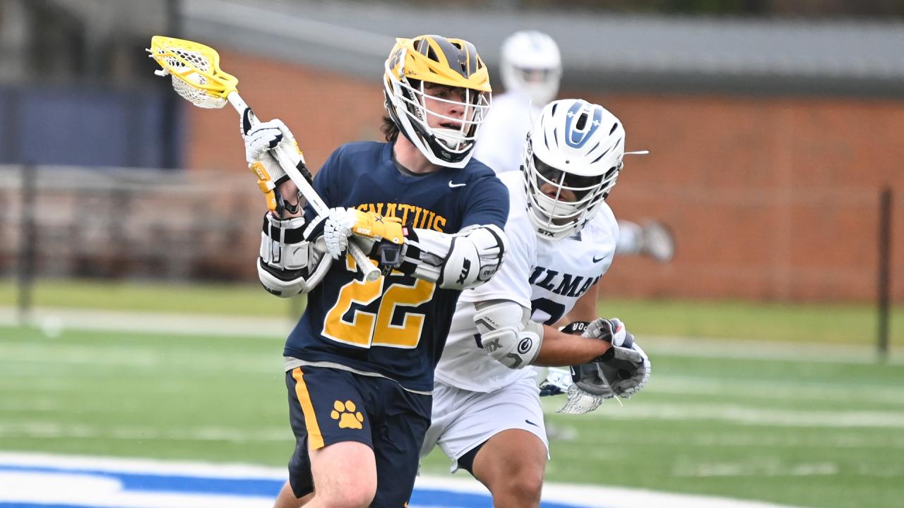 An Ignatius boys' lacrosse player readies to pass