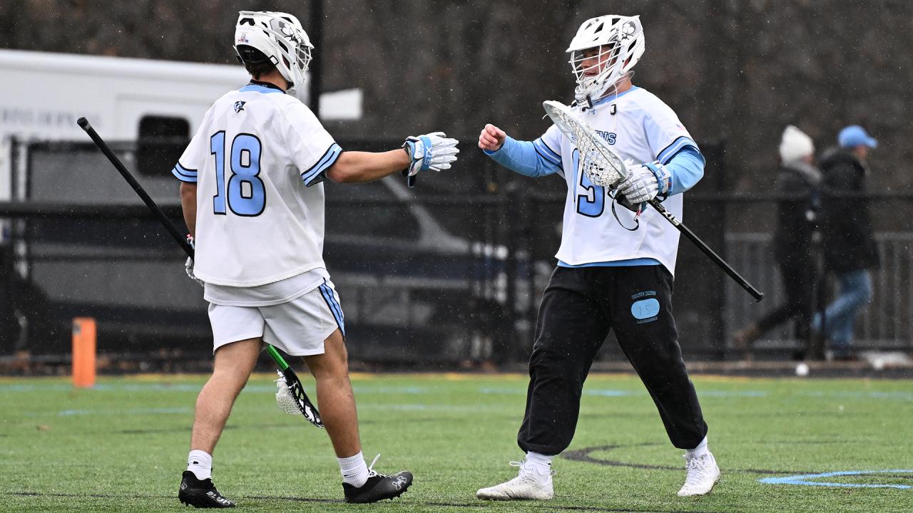 Johns Hopkins' Scott Smith and Luke Staudt shake hands