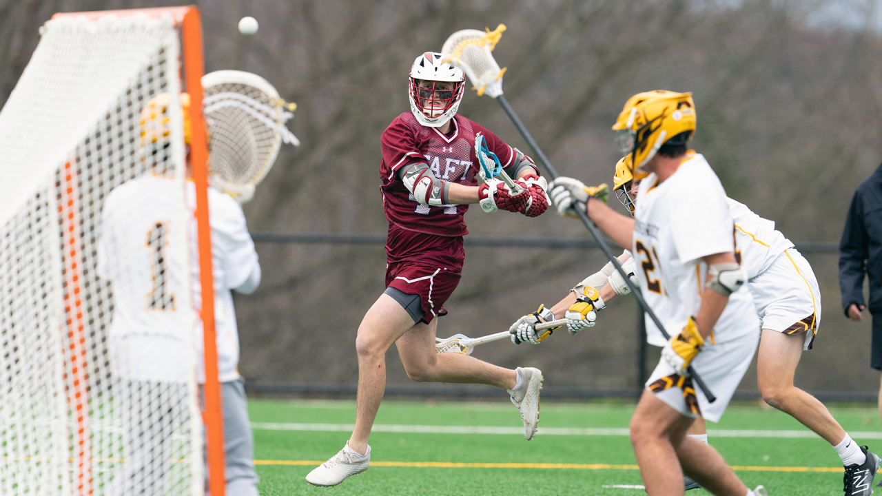 Taft (Conn.) midfielder Kaden Parsons shoots on the run during a 2024 game against Brunswick (Conn.)