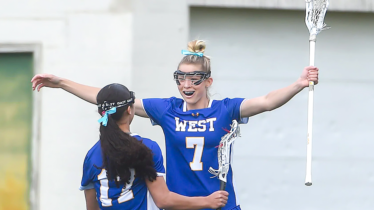 File photo of Downingtown West (Pa.) girls' lacrosse player Brinn Findora (7) celebrating with Autumn Blair.