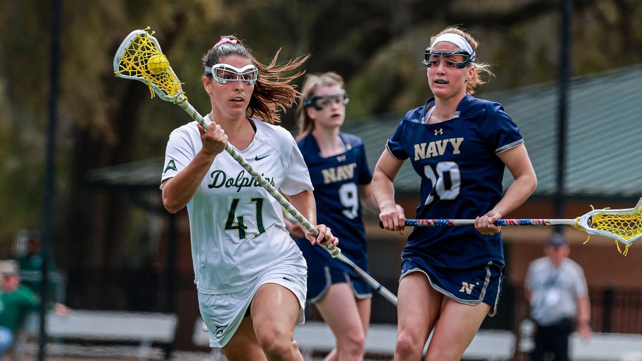 Jacksonville women's lacrosse player Maggie Cuddy runs upfield against Navy.