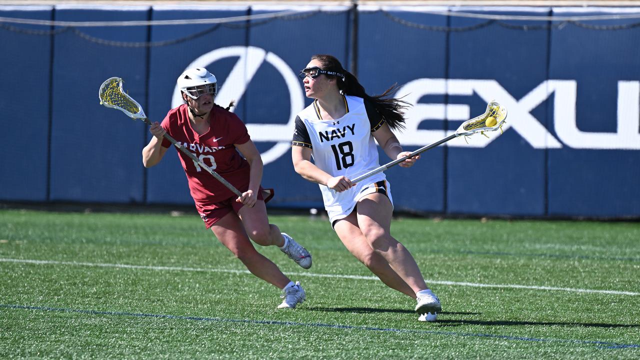 Navy's Alyssa Chung drives from behind the goal against Harvard
